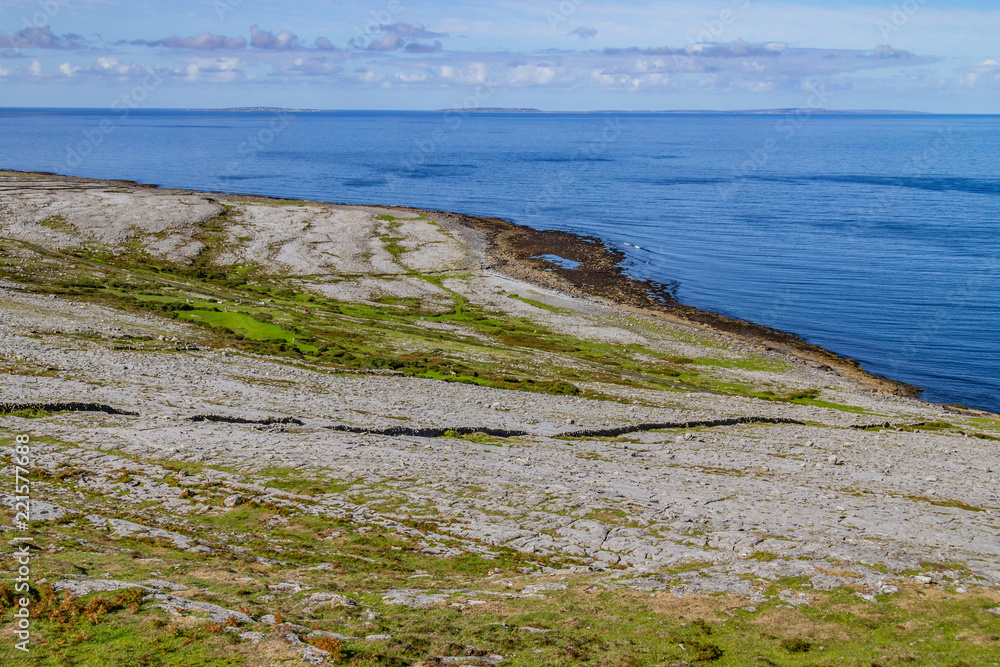 Fanore beach in Burren mountain with Aran Islands in background