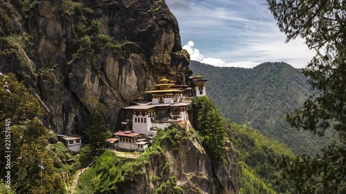 4K Timelapse movie video film of Taktshang Goemba or Tiger's nest Temple the beautiful buddhist temple.The most sacred place in Bhutan is located on the high cliff mountain with sky of Paro valley photo