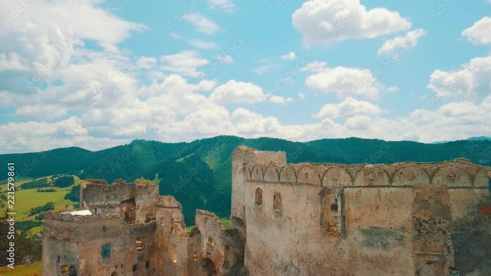 Aerial View beautiful landscape view on castle in field on the mountains background in summer sunny day with blue sky, Drone 4K Video Aerial View beautiful landscape view on castle in field on the mountains background in summer sunny day with blue sky, Drone 4K Video