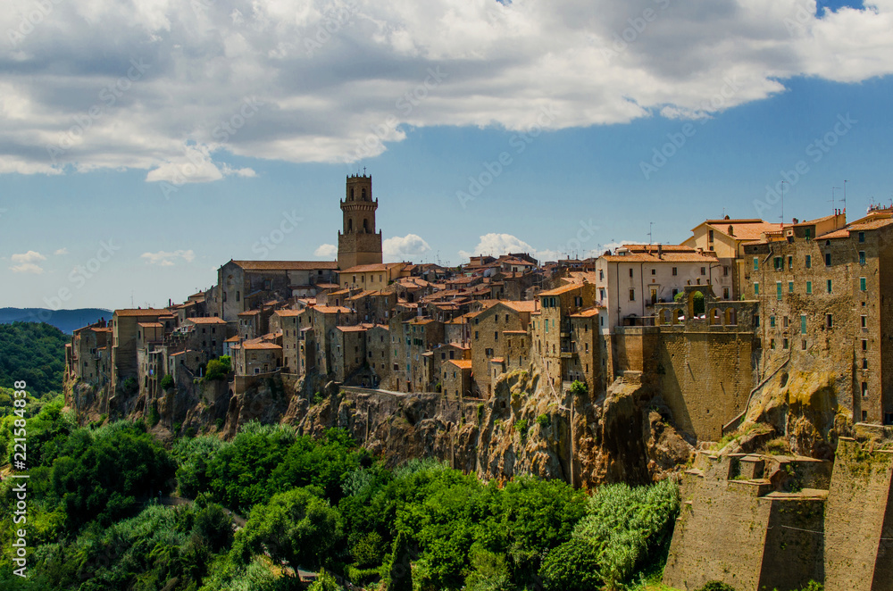 View on old town of Pitigliano with clouds on the sky, Italy