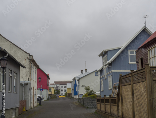 side street with old houses and street lamps in Keflevik town, Iceland photo