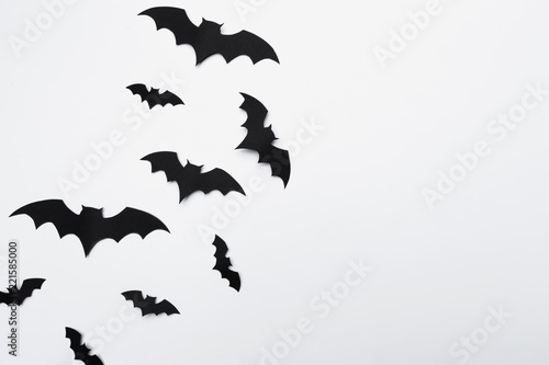 halloween and decoration concept - paper bats flying