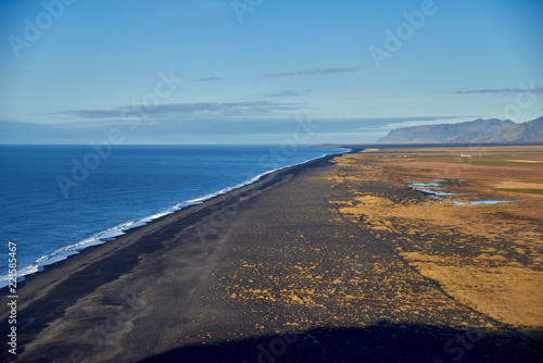View from the heights to the shore with black sand in Iceland © badahos