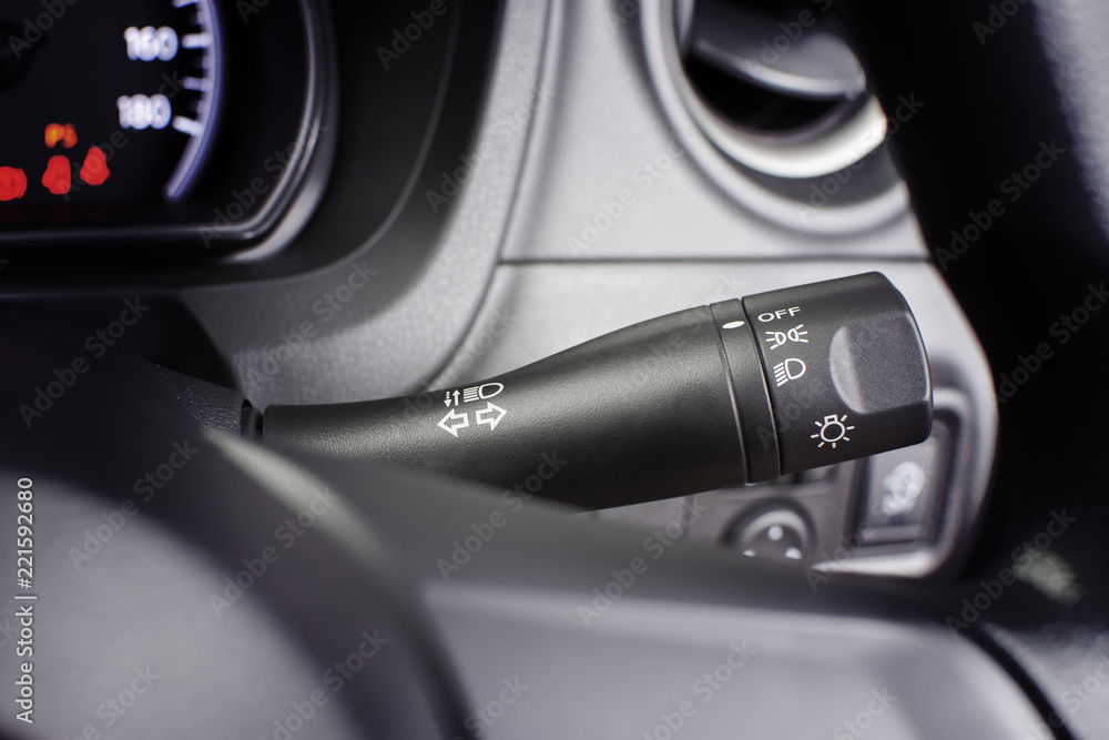 Turn signal switch and on-off switch of headlight on a beside of steering wheel, automotive part concept. Turn signal switch and on-off switch of headlight on a beside of steering wheel, automotive part concept.