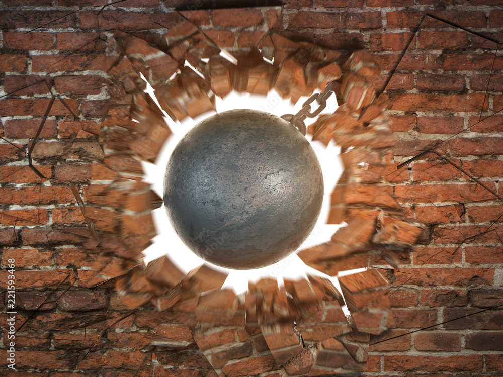 Wrecking ball destroying the brick wall