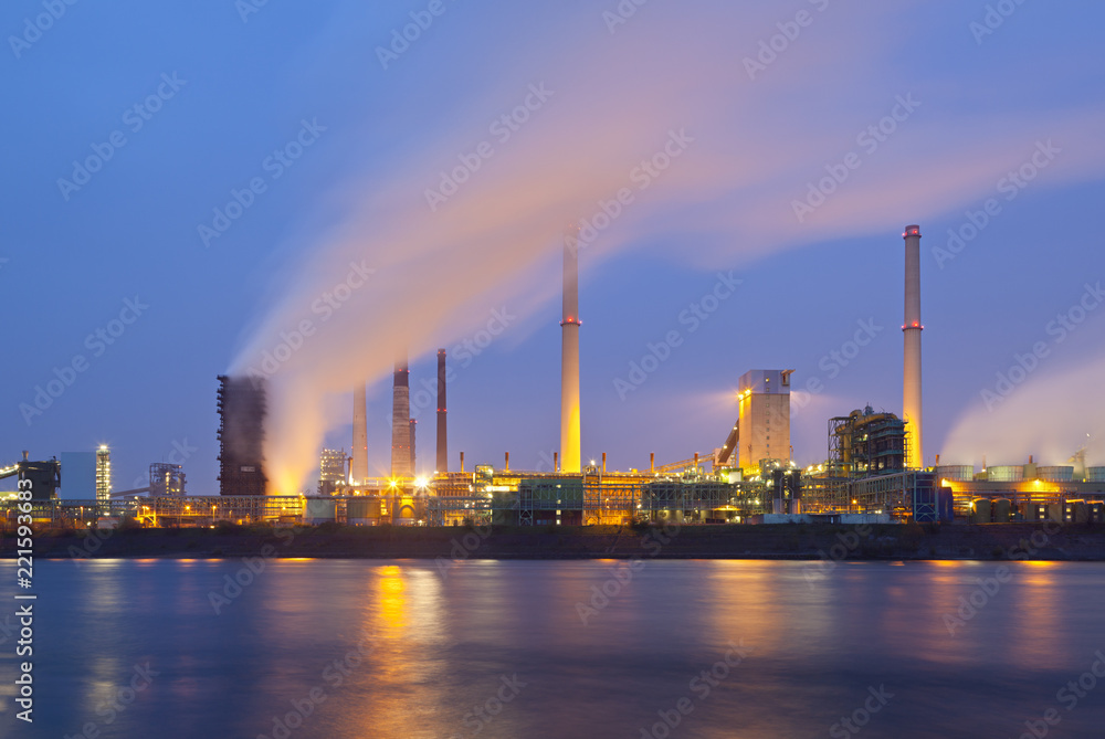 Industry By River At Night