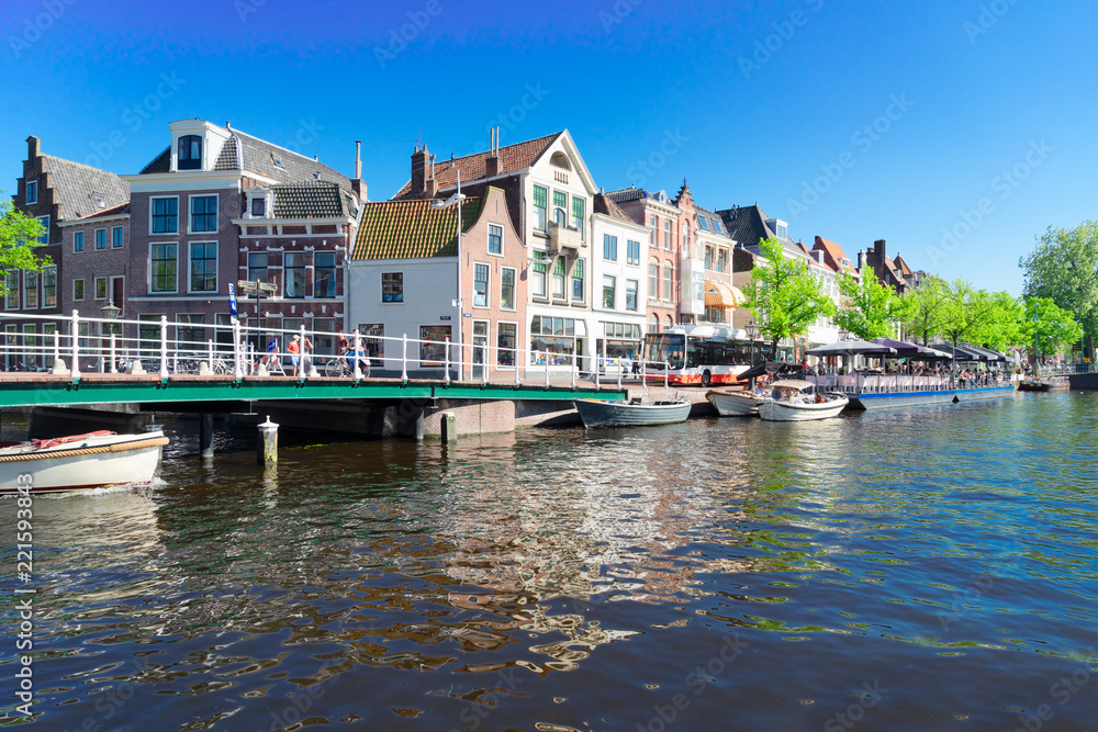bridge and canals in old town with historical houses of Leiden, Netherlands