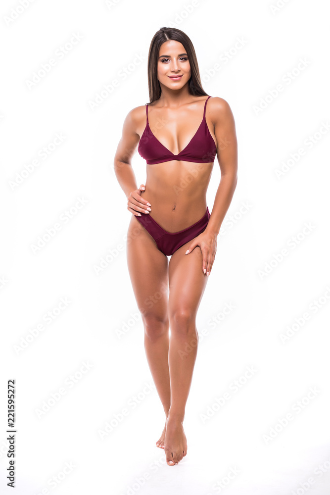 Full length portrait of young woman wearing bikini, isolated on white. Concept of summer holidays and traveling Full length portrait of young woman wearing bikini, isolated on white. Concept of summer holidays and traveling