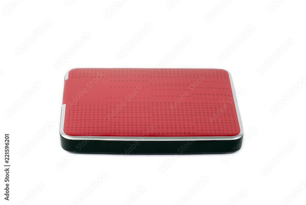 Red external hard drive for data storage and security. Portable disk hdd isolated on white background. Red external hard drive for data storage and security. Portable disk hdd isolated on white background.