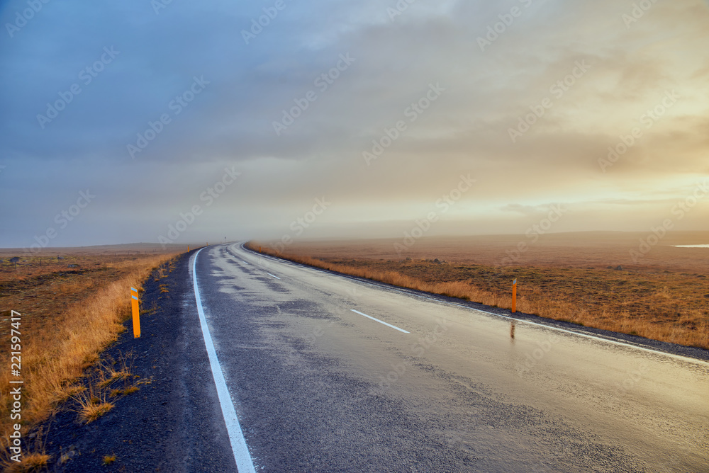 Asphalt road in fog in Iceland, Autumn Asphalt road in fog in Iceland, Autumn
