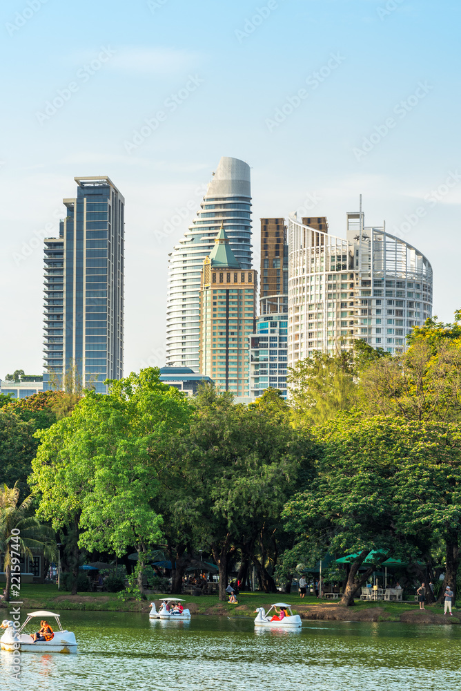 Fototapeta premium Swan paddle boats on the lake in the Lumphini Park Bangkok