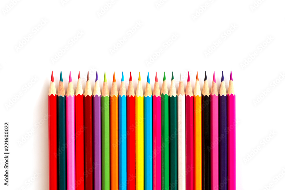 Color pencils are arranged in one line with a sharpened side on a white background. background is isolated Color pencils are arranged in one line with a sharpened side on a white background. background is isolated