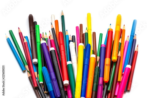 markers and colored pencils are randomly scattered. Isolated over white background