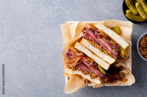 Sandwich with roast beef in wooden box. Top view. Copy space.