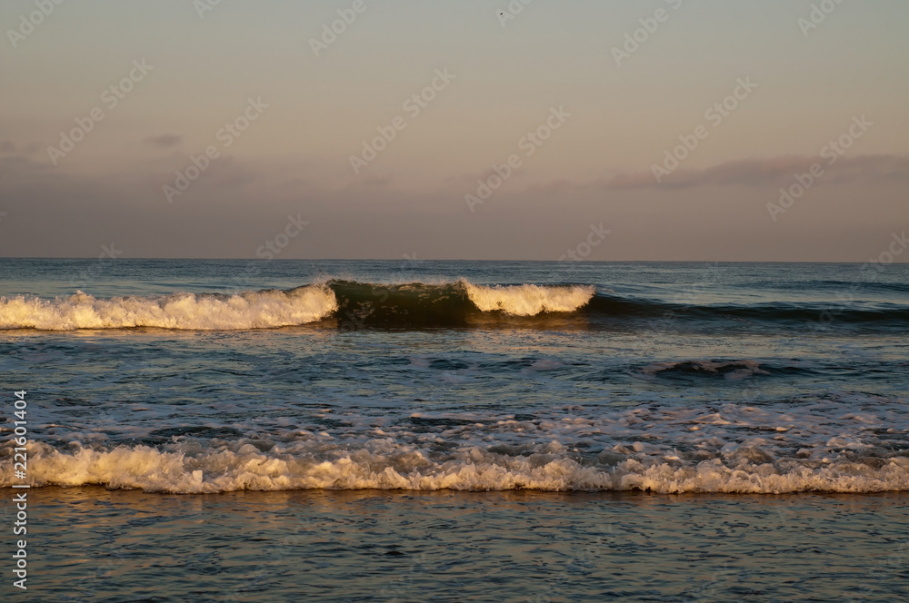 Pacific ocean waves in the early morning sunlight in Southern California, USA