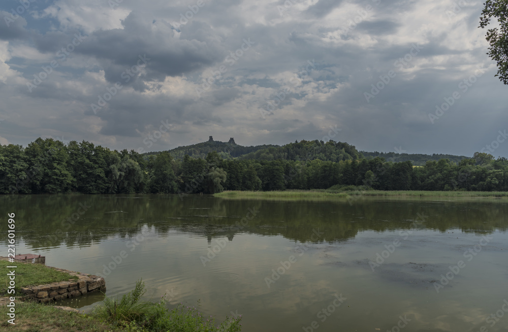 Fototapeta premium Trosky castle in summer hot day with pond