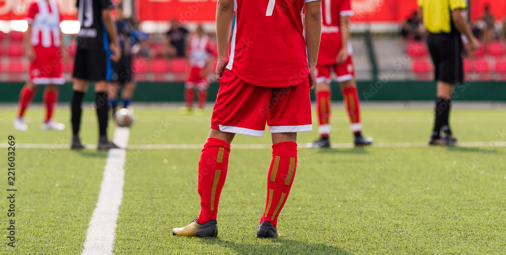 Obraz premium Young children player on the football match