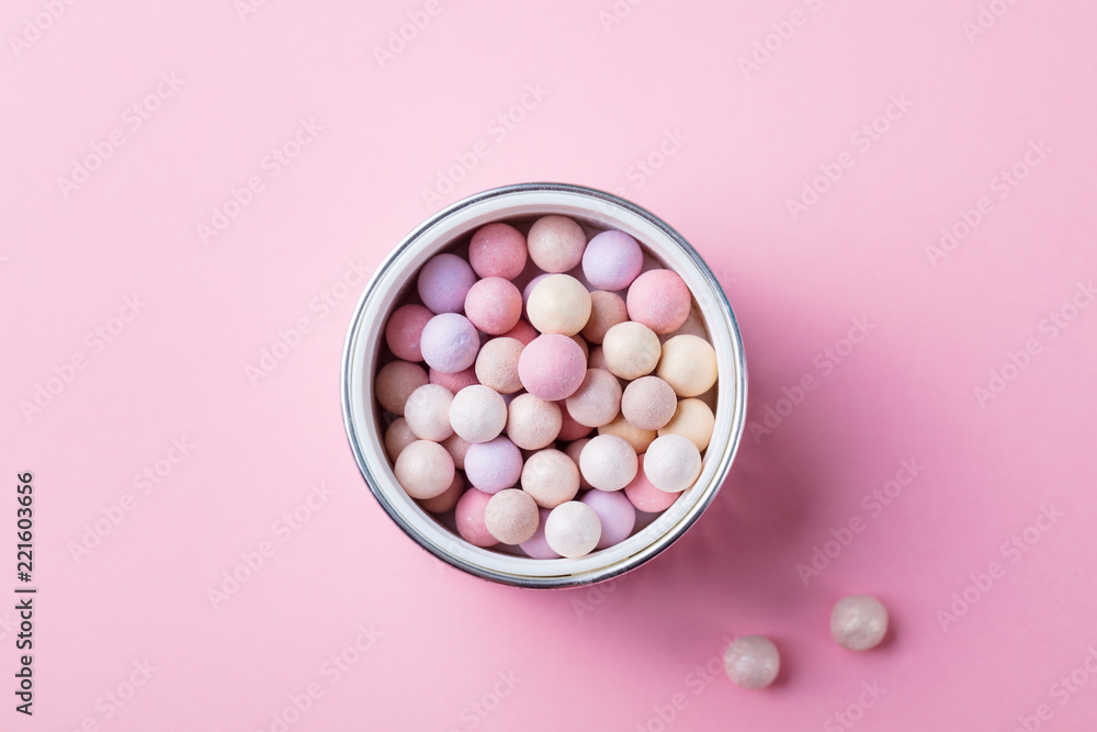 Pearl make up powder on pink pastel background. Top view. Copy space. Pearl make up powder on pink pastel background. Top view. Copy space.