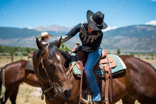 Cowgirl Smiles on Horseback
