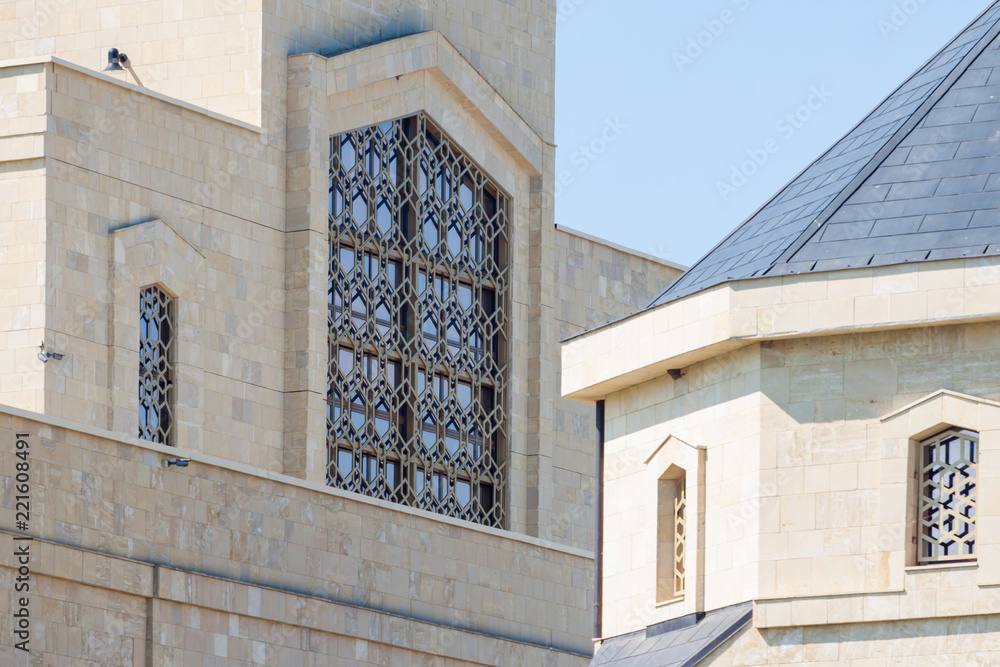 Obraz premium Stone buildings with large and small Windows.