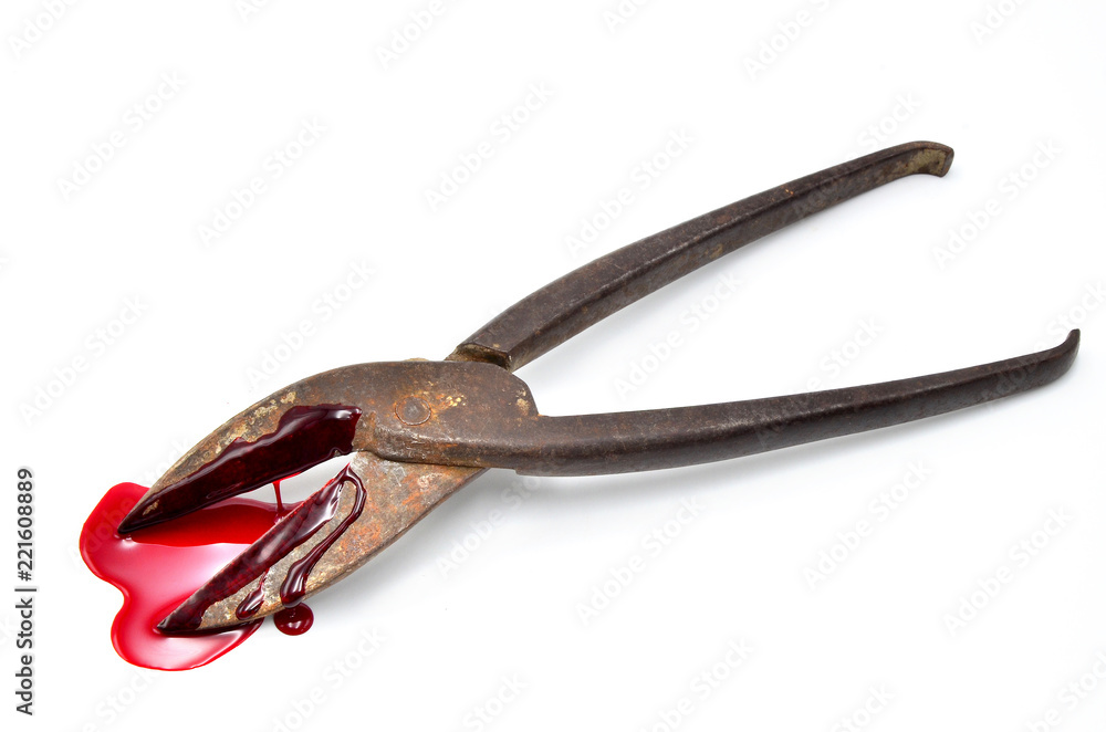 old forceps with blood on a white background old forceps with blood on a white background