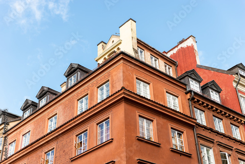 Warsaw / Poland - August 20 of 2018 : Street with colorful houses in Warsaw city. European architecture of old town in Poland. Concept of travel and city landscape. © Yuliia