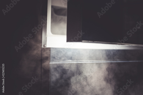 opening a refrigerator door , cold smoke