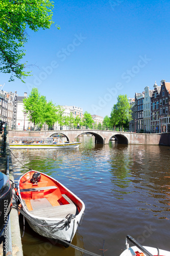 historical houses of Amsterdam over canal ring landmark in old european citye, Amsterdam spring scenery photo