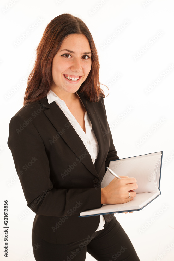 Beautiful business woman holding a folder and writting isolated over white background Beautiful business woman holding a folder and writting isolated over white background