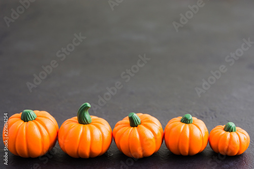 Fake pumpkin decoration on grey background