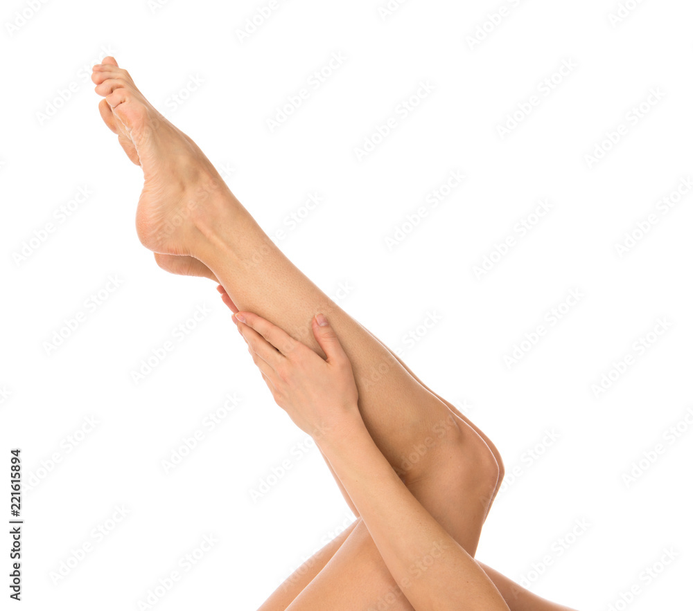 Beautiful woman hands and legs with french manicured nails isolated on a white background Beautiful woman hands and legs with french manicured nails isolated on a white background