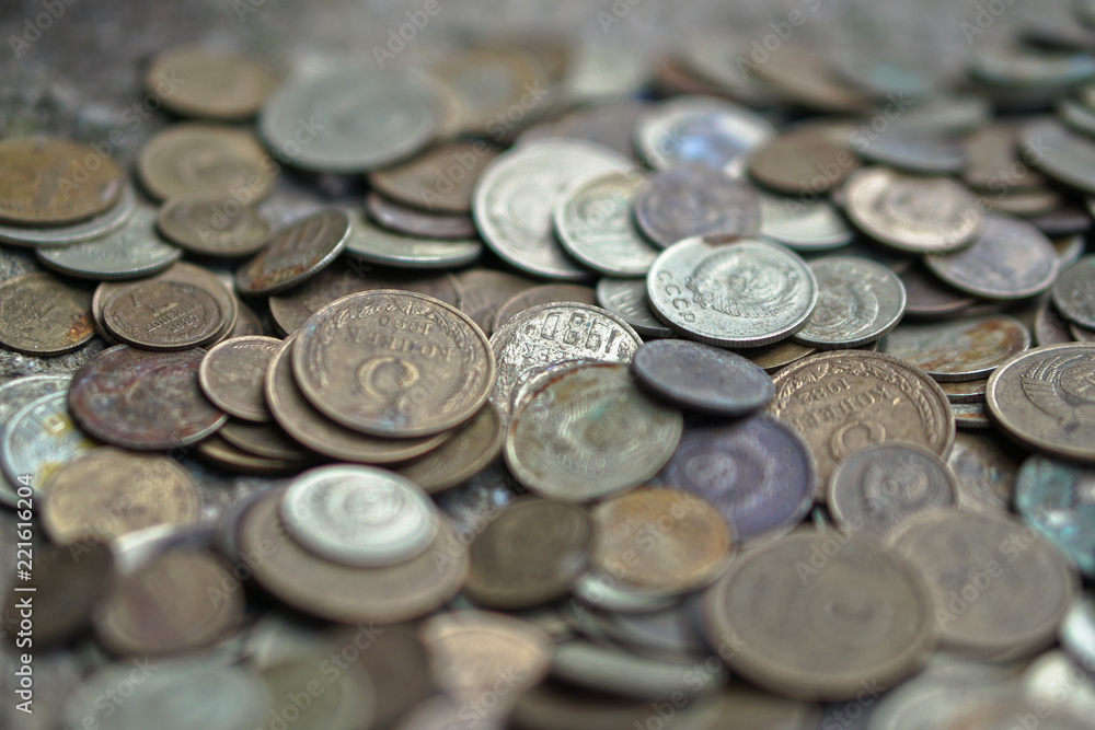 Soviet coins sprinkled on the whole frame of the photo. The USSR ruble. Old coins for numismatics. Soviet coins sprinkled on the whole frame of the photo. The USSR ruble. Old coins for numismatics.