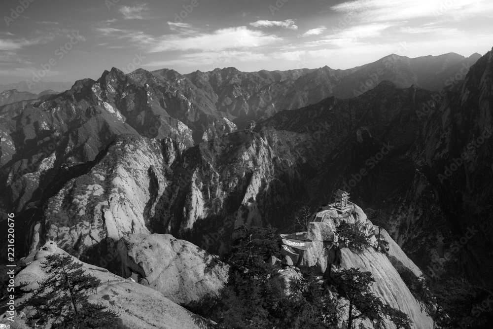 Huashan Sunset, Mount Hua - Huayin, near Xi'an in Shaanxi Province China. Chess Playing Pavilion, Pagoda at the top of a Cliff with Steep Vertical Drop-off, Famous yellow granite mountains of China.