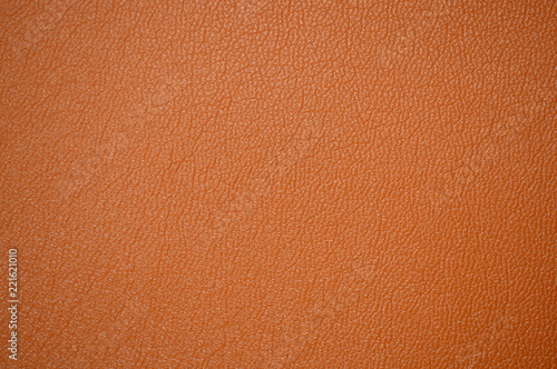 Orange beautiful leather texture as background © Yevhenii