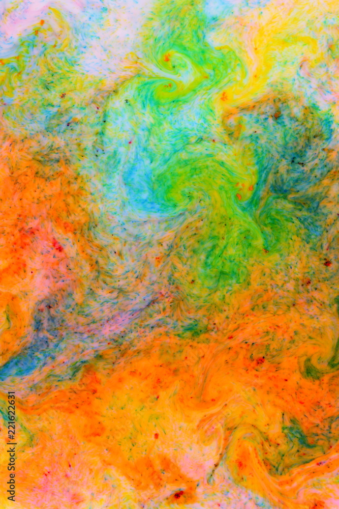 Fluid art. Abstract colorful background. Multicolored stains on liquid. Multicolored pattern with paints. Blurred background. Minimalism