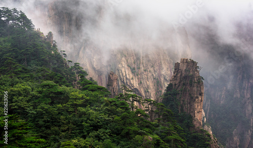 Huangshan China National Park - Anhui Province, Chinese Mountain Peak. Viewing Platform, Yellow Granite Mountains with Canyon, Exotic Pine Trees and Mist, Jagged Cliffs, UNESCO World Heritage Site © Cedar