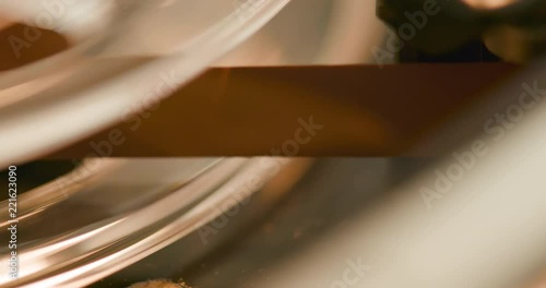 Extreme close-up of the magnetic tape of a vintage reel-to-reel audio recorder photo