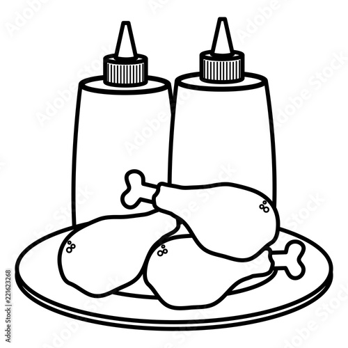 dish with chicken thighs and sauces bottles