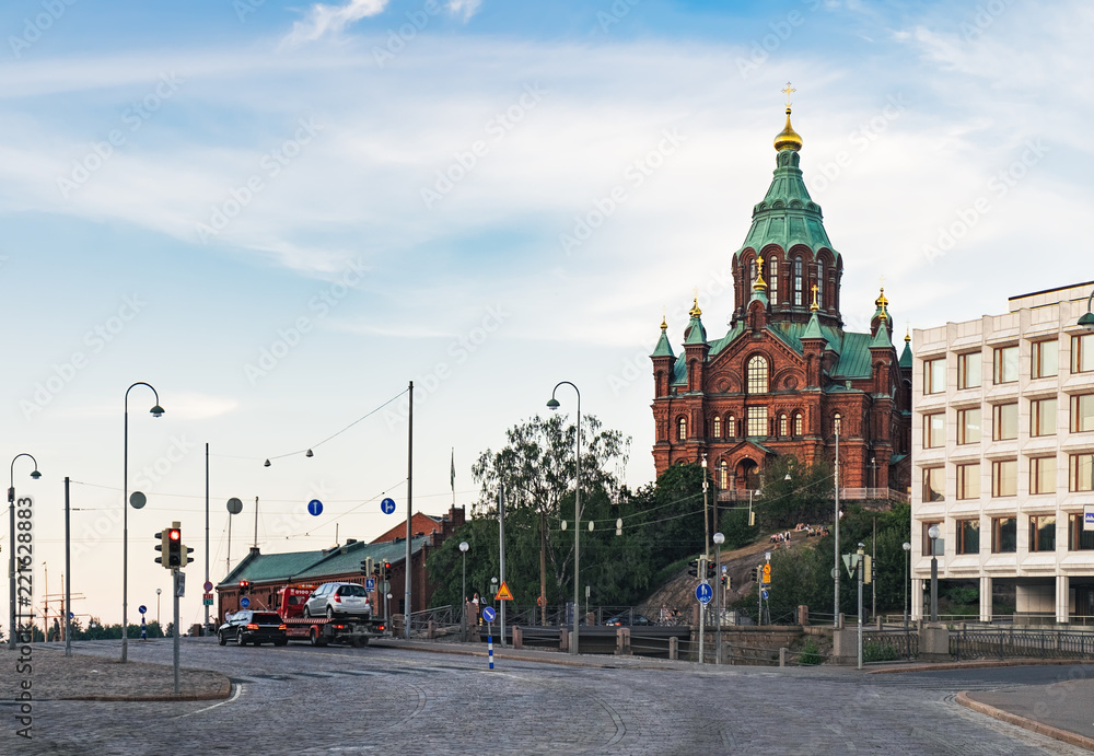 Fototapeta premium Uspenski Orthodox Cathedral Church in Katajanokka district of the Old Town at summer evening, Helsinki, Finland. View from Meritullintori Street