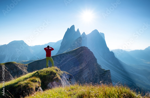 Climber on the high rocks background. Sport and active life concept. Adventure and travel in the mountain region in the Dolomites, Italy.