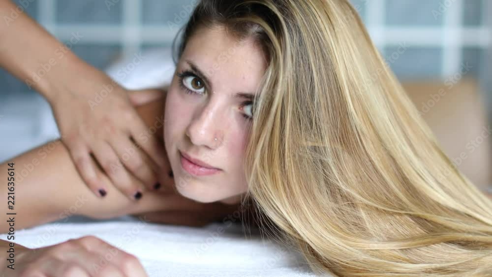 Young woman getting a massage in a spa Young woman getting a massage in a spa