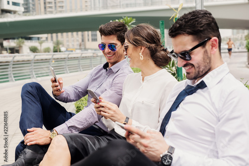 Photography Three business people in suit taking a break from hard work