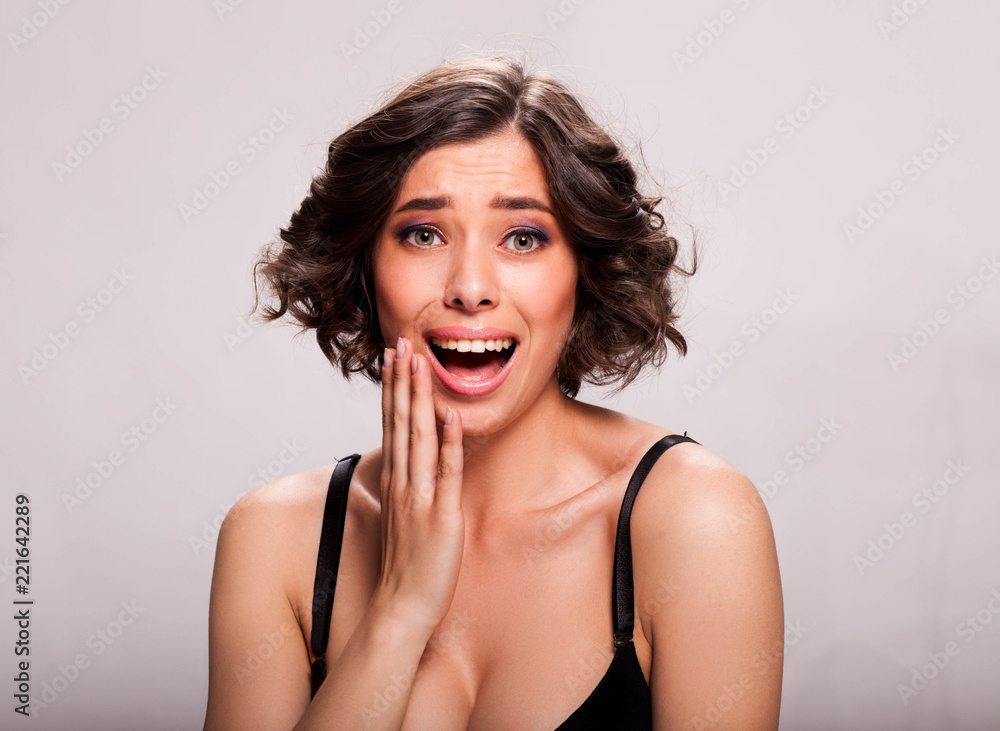 Photo of beautiful sensual woman in black bra, showing face expression Photo of beautiful sensual woman in black bra, showing face expression