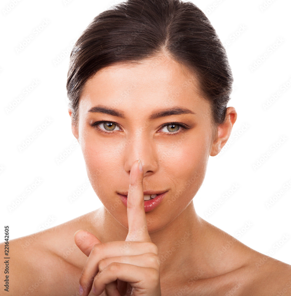 Woman with beautiful face saying shh Woman with beautiful face saying shh