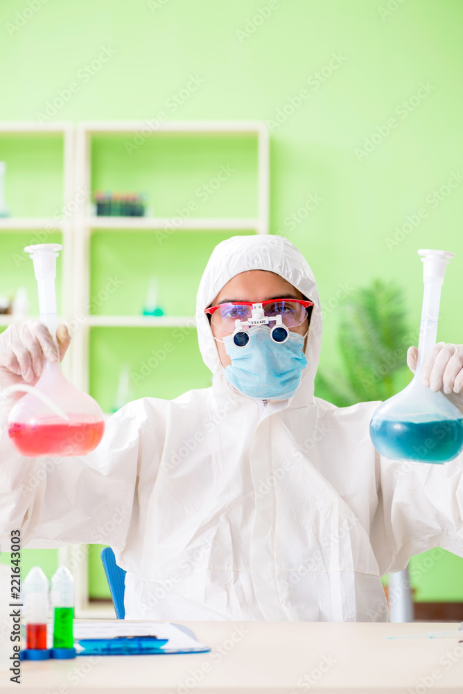 Chemist working in the lab on new experiment Chemist working in the lab on new experiment