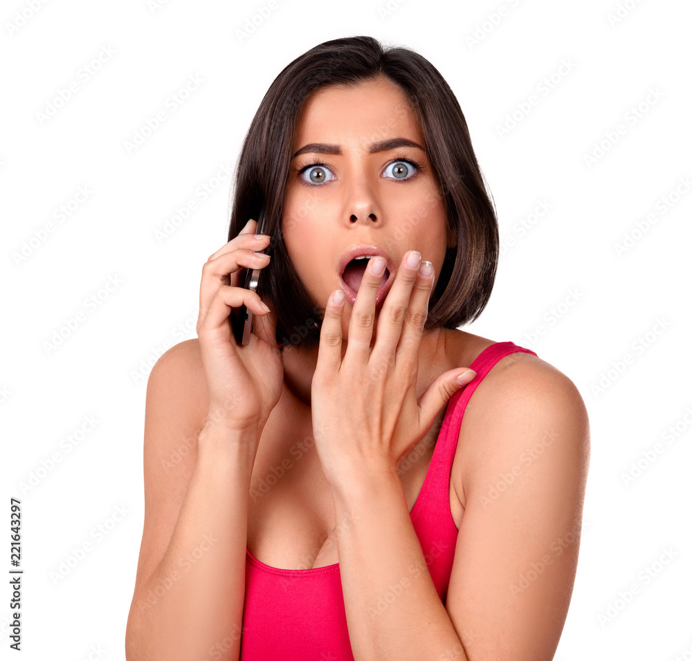 Photo of girl hearing on the phone shocking news Photo of girl hearing on the phone shocking news