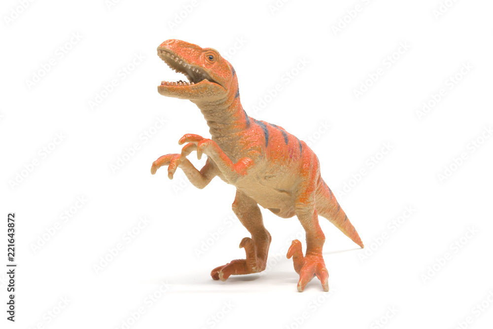 Naklejka premium Plastikowa zabawka velociraptor na białym tle