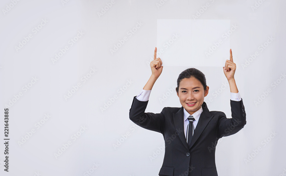 Asian businesswoman holding a blank white card Asian businesswoman holding a blank white card