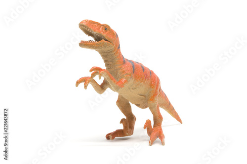 Plastic velociraptor toy isolated on white background