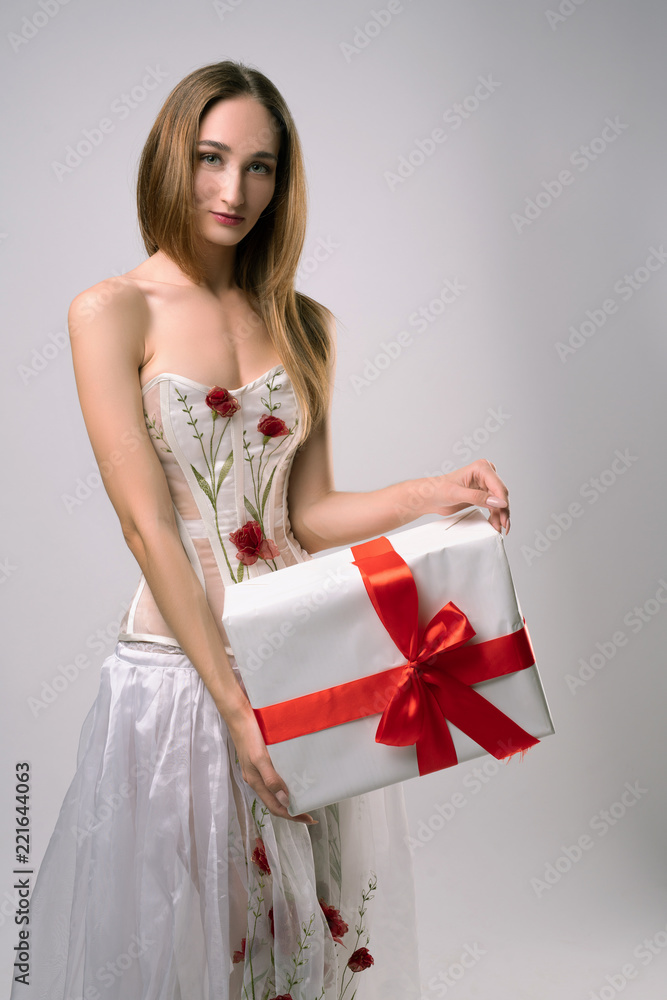 Woman in embroidered white corset and skirt Woman in embroidered white corset and skirt